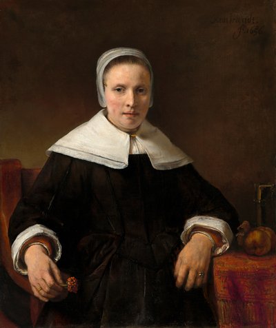 A Woman Holding a Pink by Workshop of Rembrandt